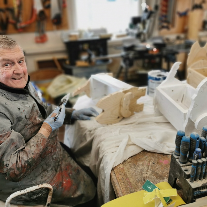 Ron painting some Westie Planters